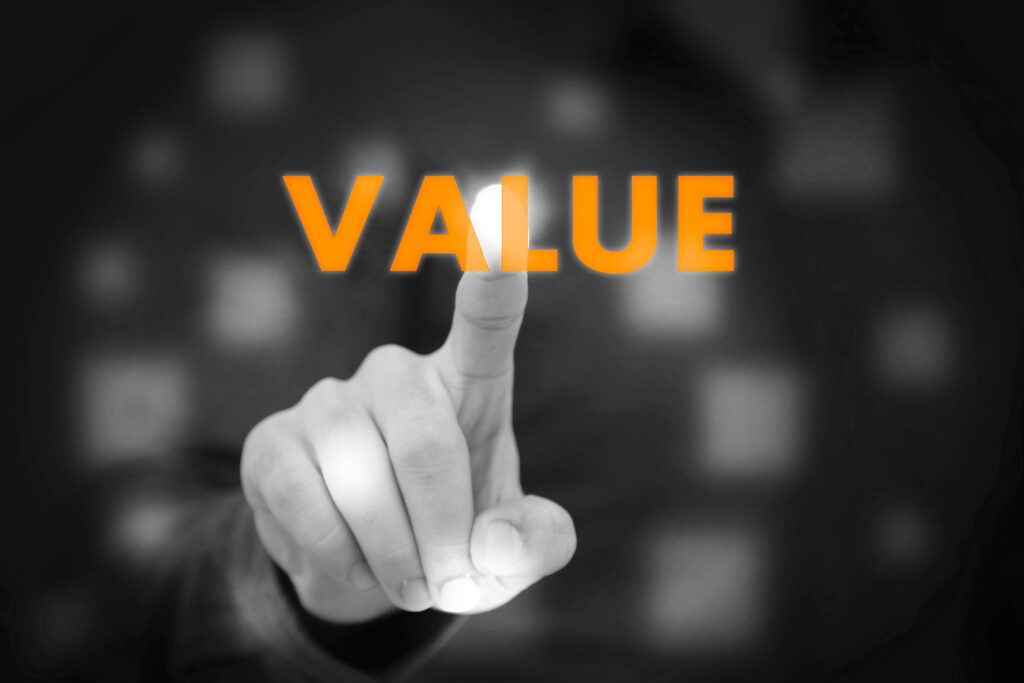 Businessman touching the word "Value"